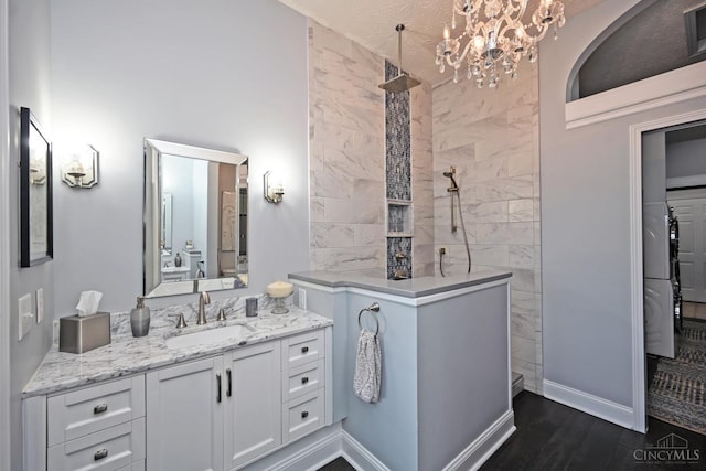 4154 Fieldsedge Dr, Mason, OH 45040 - bathroom featuring walk in shower, vanity, a chandelier, and wood finished floors