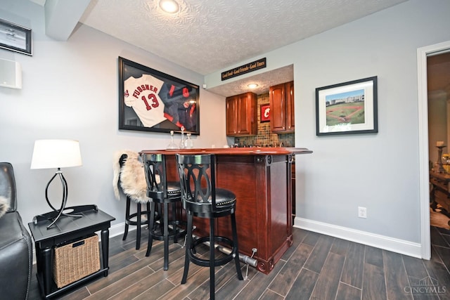 4154 Fieldsedge Dr, Mason, OH 45040 - indoor bar with wood finish floors and backsplash