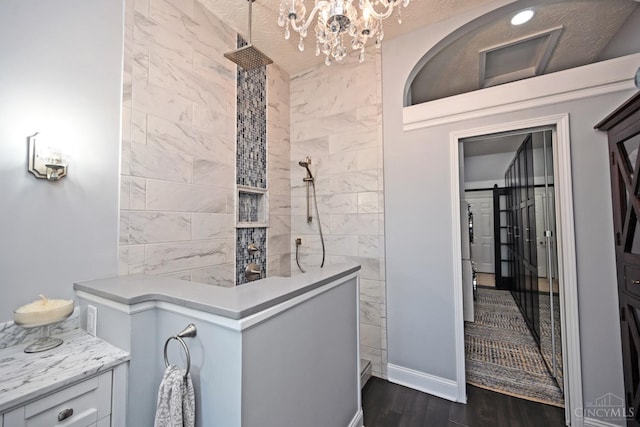 4154 Fieldsedge Dr, Mason, OH 45040 - full bathroom featuring a chandelier, a walk in shower, and wood finished floors
