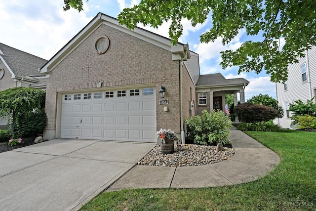 4154 Fieldsedge Dr, Mason, OH 45040 - traditional-style house featuring brick siding, driveway, an attached garage, and a front lawn