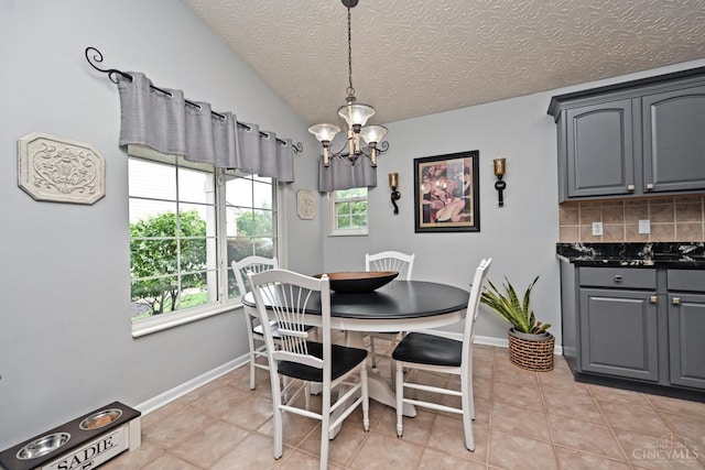 4154 Fieldsedge Dr, Mason, OH 45040 - dining room featuring a chandelier, light tile patterned floors, and a textured ceiling