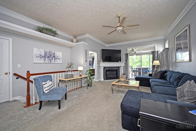 4154 Fieldsedge Dr, Mason, OH 45040 - carpeted living room with a ceiling fan, a glass covered fireplace, crown molding, and a textured ceiling
