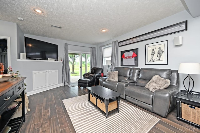 4154 Fieldsedge Dr, Mason, OH 45040 - living room with dark wood-style flooring, a textured ceiling, and recessed lighting
