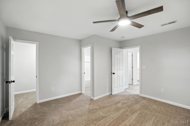 152 N College St, Sabina, OH 45169 - unfurnished bedroom featuring carpet floors and a ceiling fan