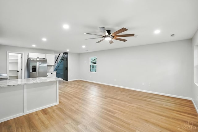 152 N College St, Sabina, OH 45169 - unfurnished living room featuring a ceiling fan, recessed lighting, and light wood-type flooring