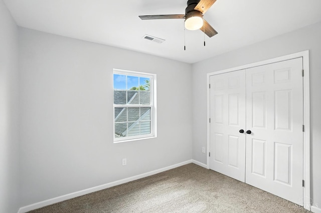 152 N College St, Sabina, OH 45169 - unfurnished bedroom with carpet flooring, a closet, and ceiling fan