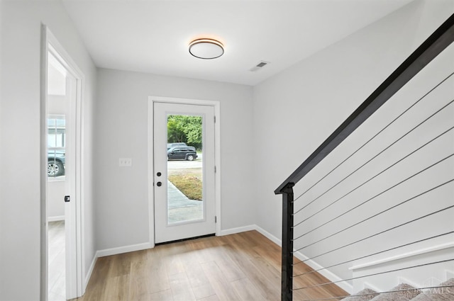 152 N College St, Sabina, OH 45169 - foyer entrance featuring light wood finished floors and baseboards