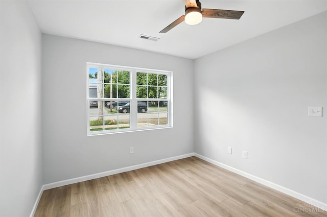 152 N College St, Sabina, OH 45169 - empty room featuring light wood-style flooring and a ceiling fan