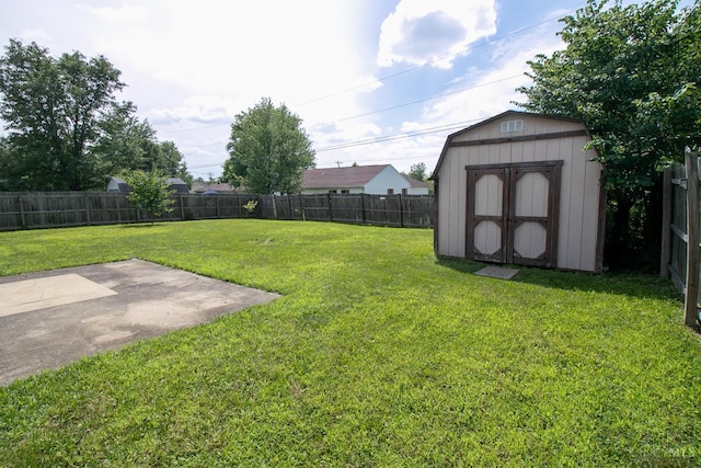 881 Trails End Dr, Liberty Twp, OH 45050 - fenced backyard featuring a storage unit and a patio