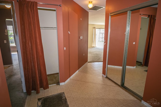 881 Trails End Dr, Liberty Twp, OH 45050 - hallway with plenty of natural light and carpet flooring