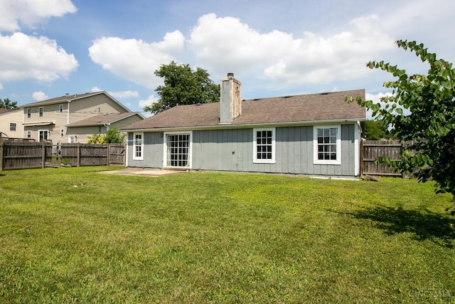 881 Trails End Dr, Liberty Twp, OH 45050 - back of house featuring a chimney, a fenced backyard, a patio area, and board and batten siding