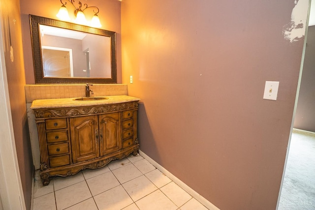 881 Trails End Dr, Liberty Twp, OH 45050 - bathroom featuring vanity, tasteful backsplash, and tile patterned floors
