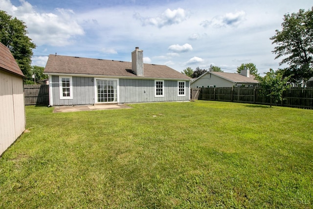 881 Trails End Dr, Liberty Twp, OH 45050 - rear view of property with a chimney, a fenced backyard, and a patio area