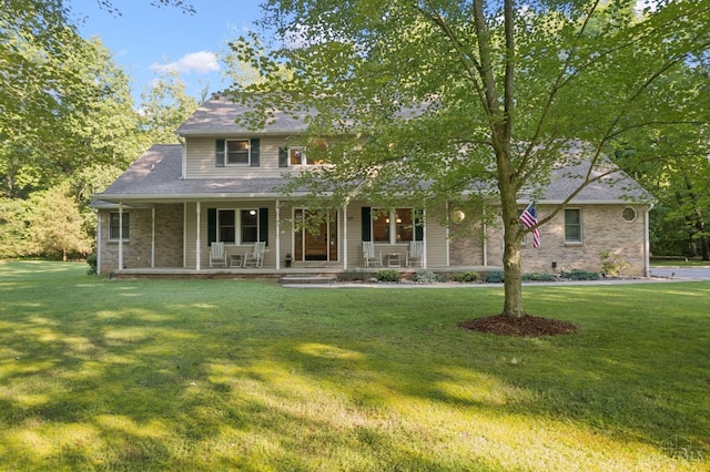 3067 Sugartree Rd, Tate Twp, OH 45106 - view of front facade with a porch, a front yard, and brick siding