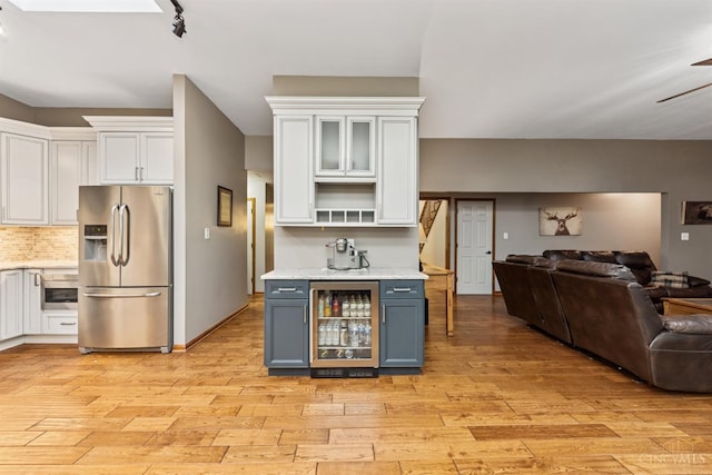 3067 Sugartree Rd, Tate Twp, OH 45106 - kitchen with stainless steel refrigerator with ice dispenser, beverage cooler, open floor plan, white cabinetry, and open shelves