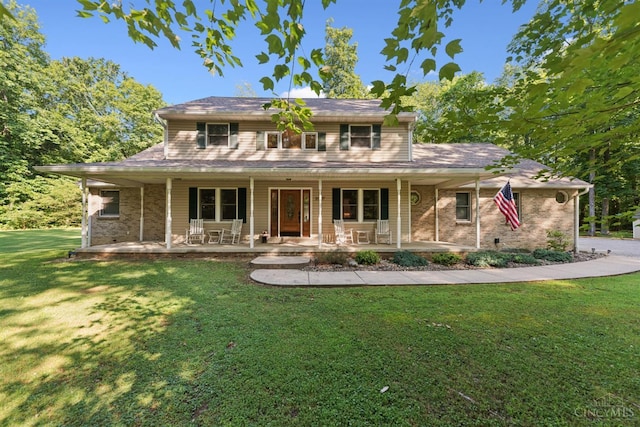 3067 Sugartree Rd, Tate Twp, OH 45106 - view of front of house featuring a front yard, covered porch, and brick siding