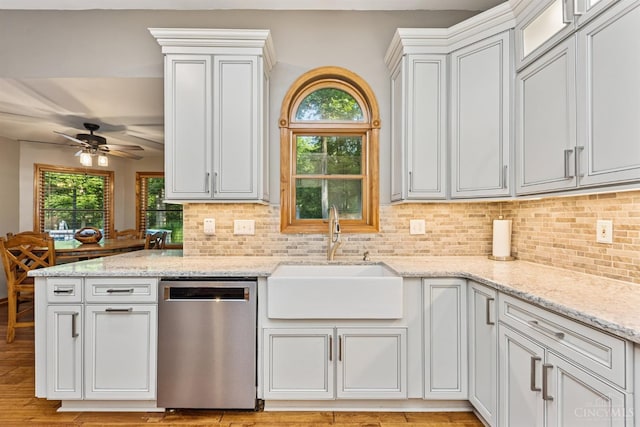 3067 Sugartree Rd, Tate Twp, OH 45106 - kitchen featuring stainless steel dishwasher, decorative backsplash, a ceiling fan, and plenty of natural light