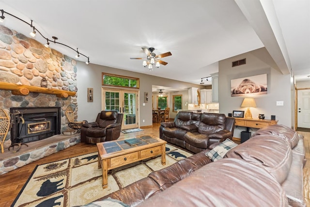 3067 Sugartree Rd, Tate Twp, OH 45106 - living area with rail lighting, ceiling fan, and wood finished floors