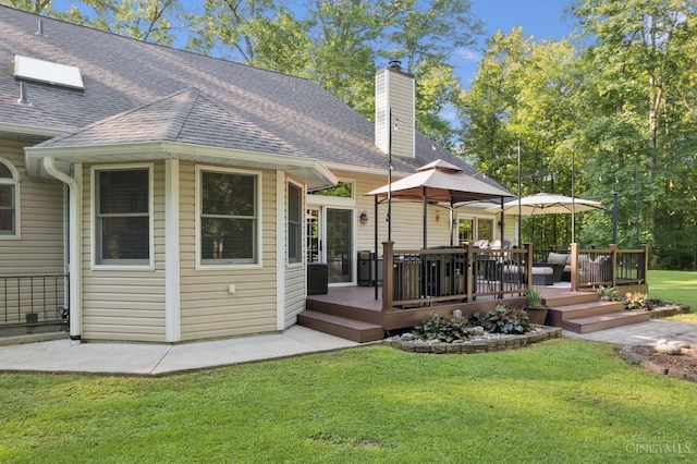 3067 Sugartree Rd, Tate Twp, OH 45106 - rear view of house with a lawn, a chimney, roof with shingles, and a deck