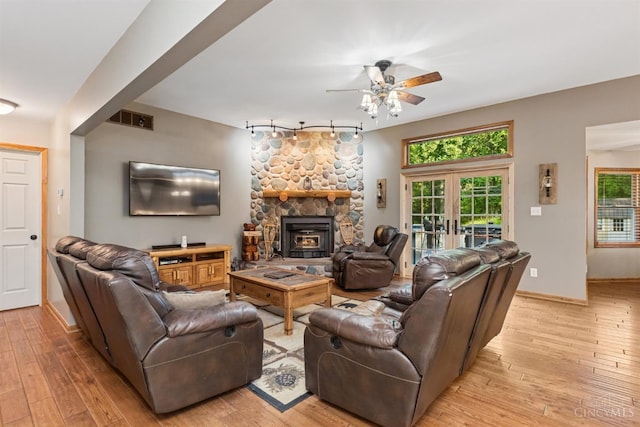 3067 Sugartree Rd, Tate Twp, OH 45106 - living room with ceiling fan, light wood-style floors, french doors, rail lighting, and a fireplace