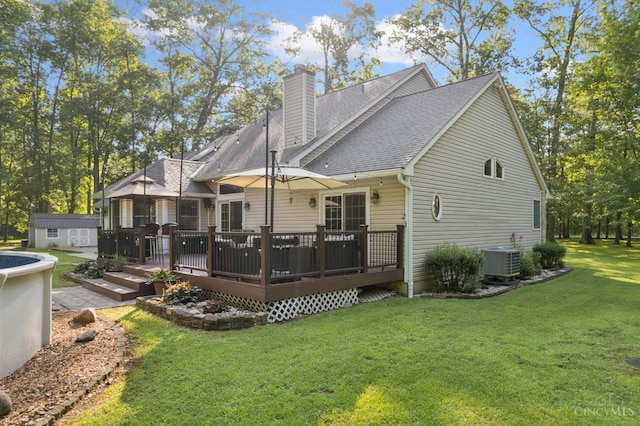 3067 Sugartree Rd, Tate Twp, OH 45106 - rear view of property featuring a shingled roof, a chimney, a lawn, a wooden deck, and a shed