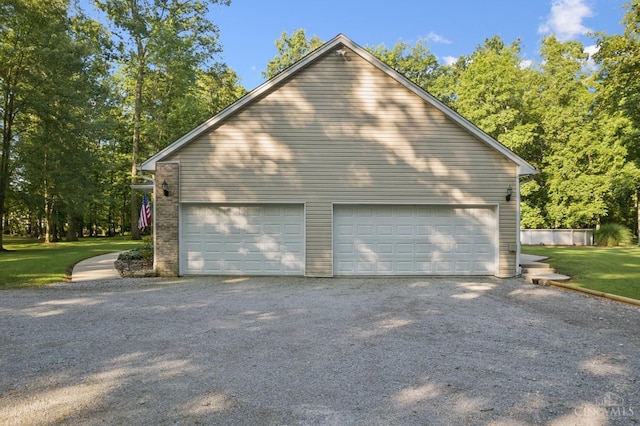 3067 Sugartree Rd, Tate Twp, OH 45106 - view of home's exterior with a detached garage, a lawn, and an outdoor structure