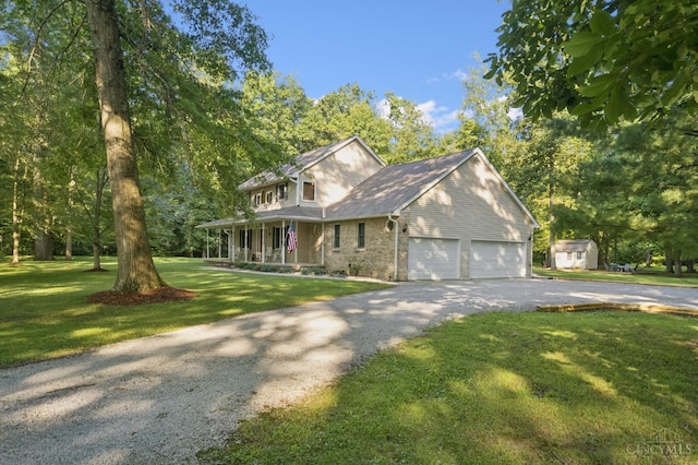 3067 Sugartree Rd, Tate Twp, OH 45106 - view of front of house featuring asphalt driveway, covered porch, an attached garage, a front yard, and brick siding