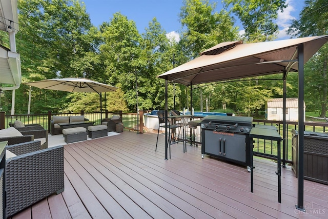 3067 Sugartree Rd, Tate Twp, OH 45106 - deck featuring an outdoor living space, a storage unit, area for grilling, view of scattered trees, and a gazebo