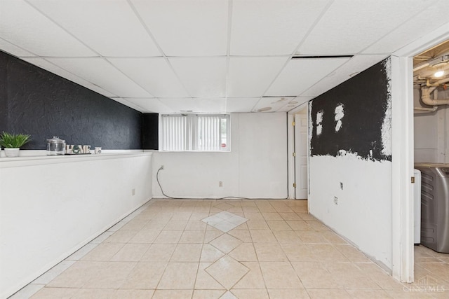 3252 Struble, Colerain Twp, OH 45251 - basement with a paneled ceiling, washer / clothes dryer, and light tile patterned floors