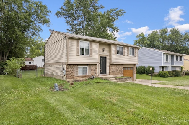 3252 Struble, Colerain Twp, OH 45251 - bi-level home with an attached garage, brick siding, and driveway