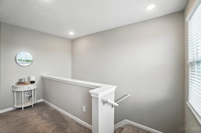 2821 Pine Leaf Ct, Hamilton, OH 45013 - hallway with an upstairs landing, dark colored carpet, and recessed lighting