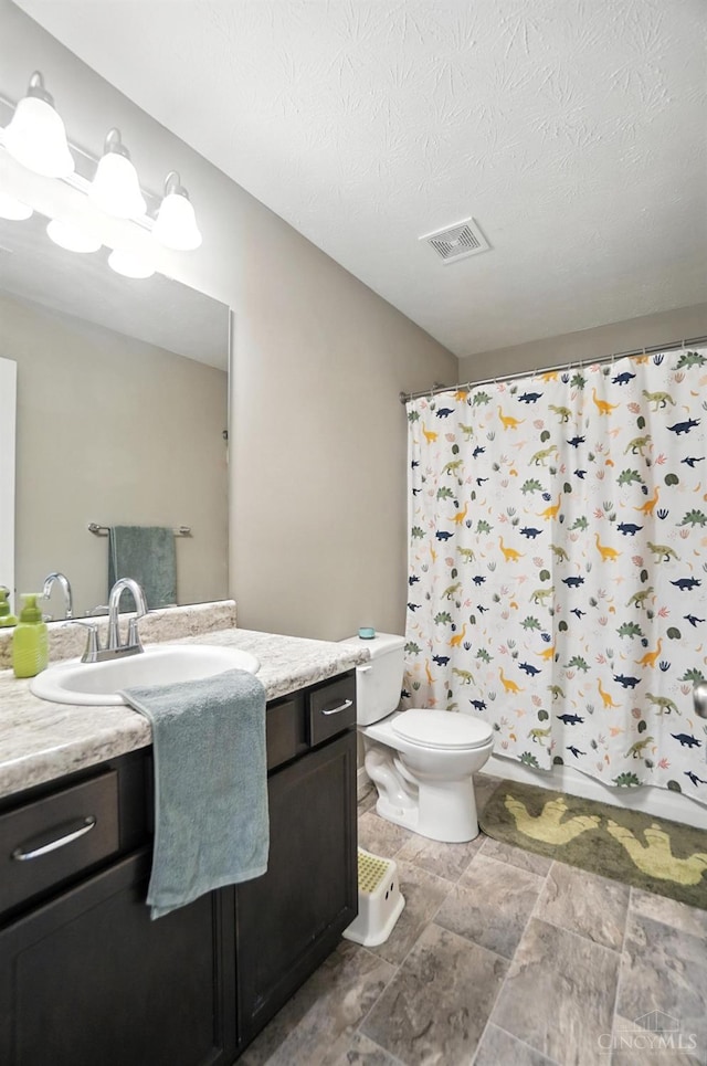 2821 Pine Leaf Ct, Hamilton, OH 45013 - full bath with vanity, curtained shower, a textured ceiling, and stone finish flooring
