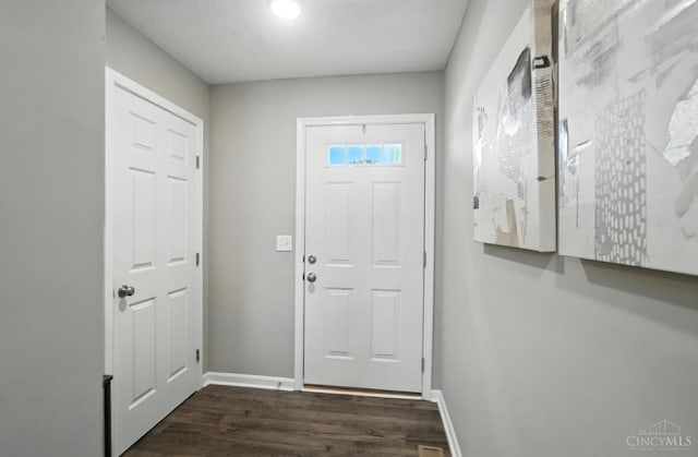 2821 Pine Leaf Ct, Hamilton, OH 45013 - doorway with dark wood-style floors and baseboards