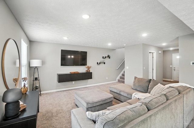2821 Pine Leaf Ct, Hamilton, OH 45013 - carpeted living area with stairway, a textured ceiling, and recessed lighting