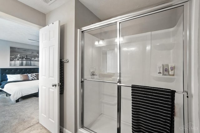 2821 Pine Leaf Ct, Hamilton, OH 45013 - ensuite bathroom with a stall shower and a textured ceiling