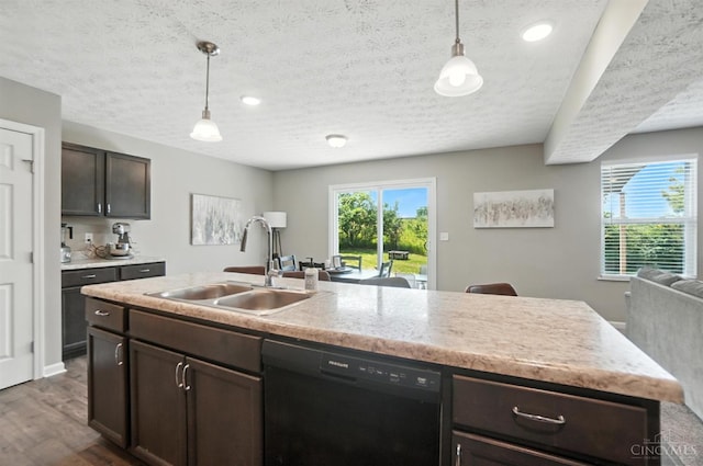 2821 Pine Leaf Ct, Hamilton, OH 45013 - kitchen with dishwasher, open floor plan, a textured ceiling, dark brown cabinets, and light countertops
