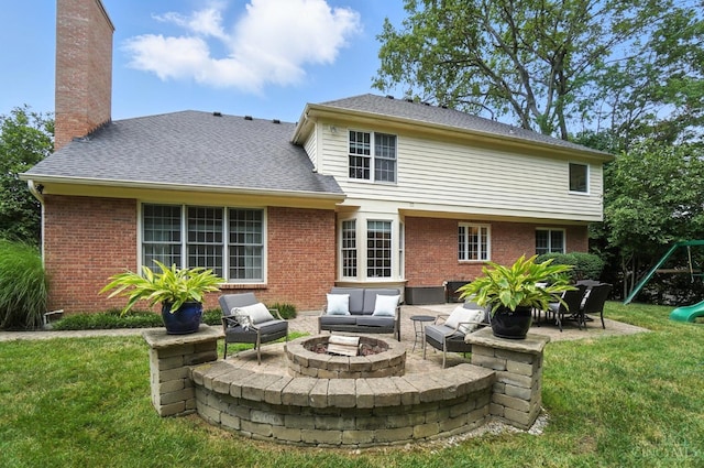 7070 Ravens Run, Anderson Twp, OH 45244 - rear view of property with an outdoor living space with a fire pit, a patio, brick siding, and a playground