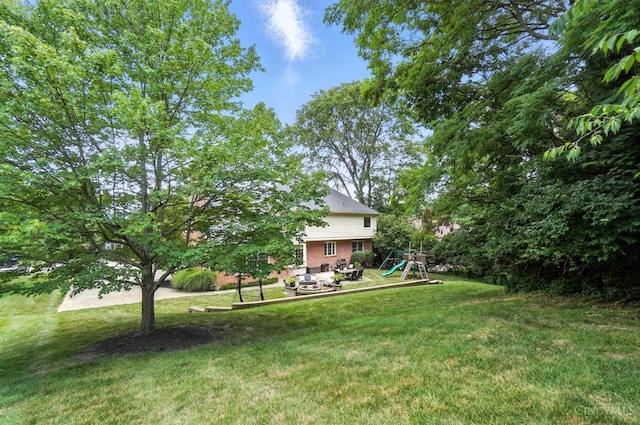 7070 Ravens Run, Anderson Twp, OH 45244 - view of green lawn featuring a playground and a patio