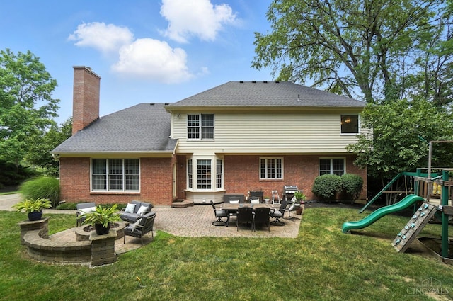 7070 Ravens Run, Anderson Twp, OH 45244 - back of house with a yard, a playground, a patio area, and brick siding
