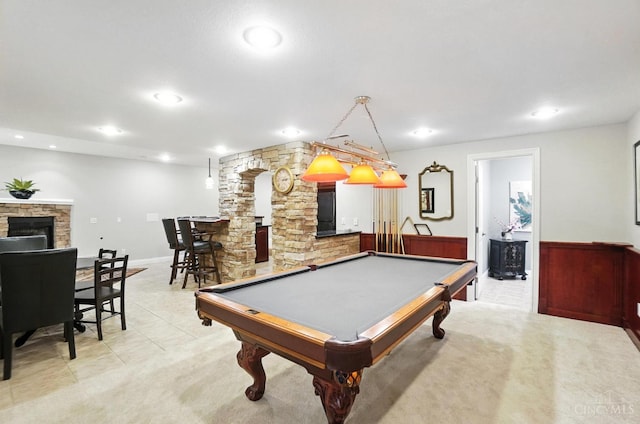 7070 Ravens Run, Anderson Twp, OH 45244 - game room with a fireplace, pool table, recessed lighting, light colored carpet, and decorative columns