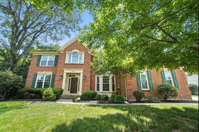 7070 Ravens Run, Anderson Twp, OH 45244 - view of front facade featuring a front lawn and brick siding