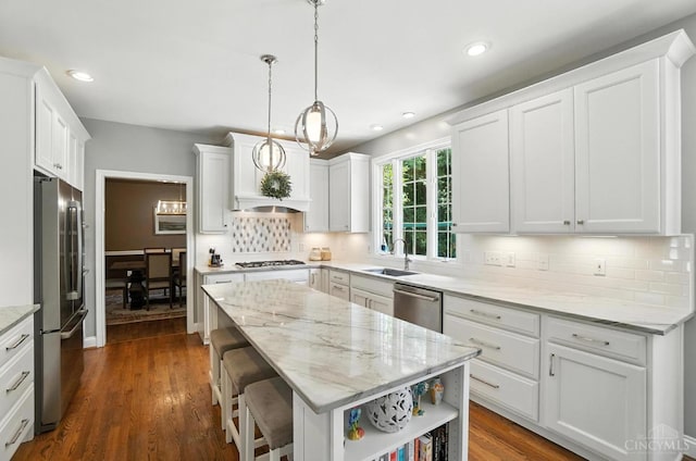 7070 Ravens Run, Anderson Twp, OH 45244 - kitchen featuring stainless steel appliances, a kitchen island, decorative backsplash, white cabinetry, and recessed lighting