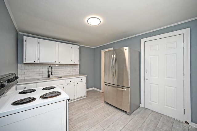 26 Boltin St, Dayton, OH 45403 - kitchen featuring freestanding refrigerator, white electric range, ornamental molding, light countertops, and white cabinets