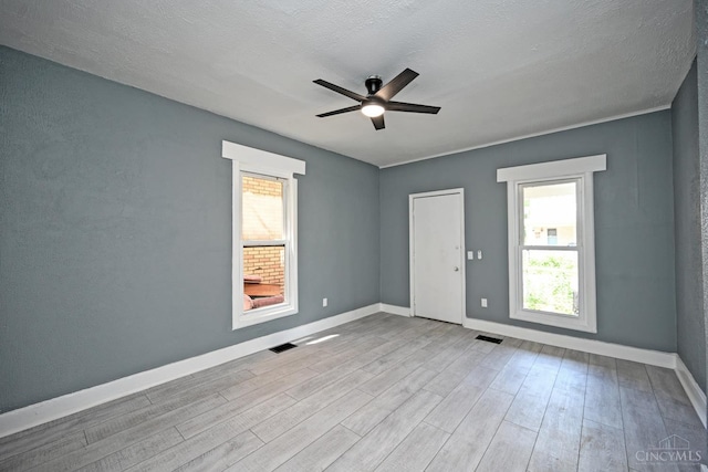26 Boltin St, Dayton, OH 45403 - unfurnished room with wood finished floors, ceiling fan, and plenty of natural light
