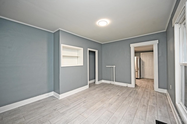 26 Boltin St, Dayton, OH 45403 - spare room with wood finished floors and crown molding