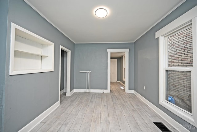 26 Boltin St, Dayton, OH 45403 - unfurnished room featuring wood finished floors and crown molding