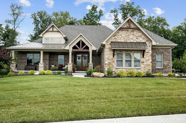 7574 Copper Creek Ln, Colerain Twp, OH 45247 - craftsman inspired home with french doors, a standing seam roof, stone siding, a front lawn, and a porch