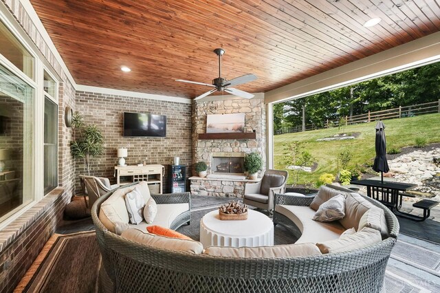 7574 Copper Creek Ln, Colerain Twp, OH 45247 - view of patio with an outdoor living space with a fireplace and a ceiling fan