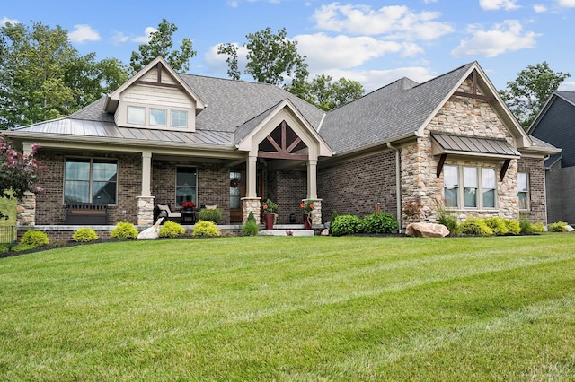 7574 Copper Creek Ln, Colerain Twp, OH 45247 - craftsman house with a porch, a front lawn, stone siding, and a metal roof