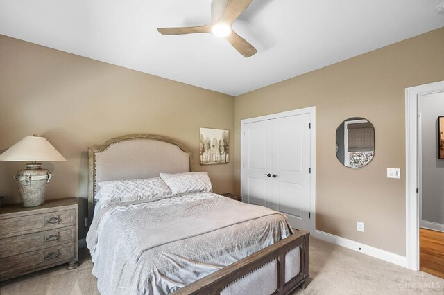 7574 Copper Creek Ln, Colerain Twp, OH 45247 - bedroom featuring light colored carpet, a closet, and a ceiling fan